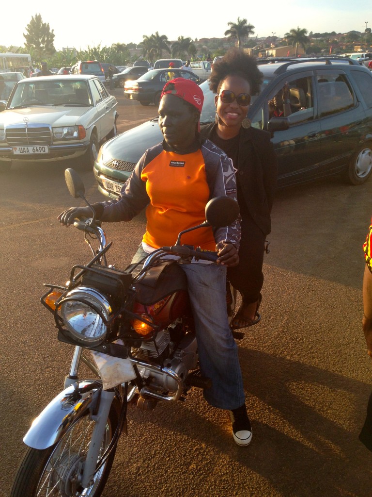 About to take off with Naume, Kampala's first female boda boda driver. Moto taxis are called bodas in Uganda.
