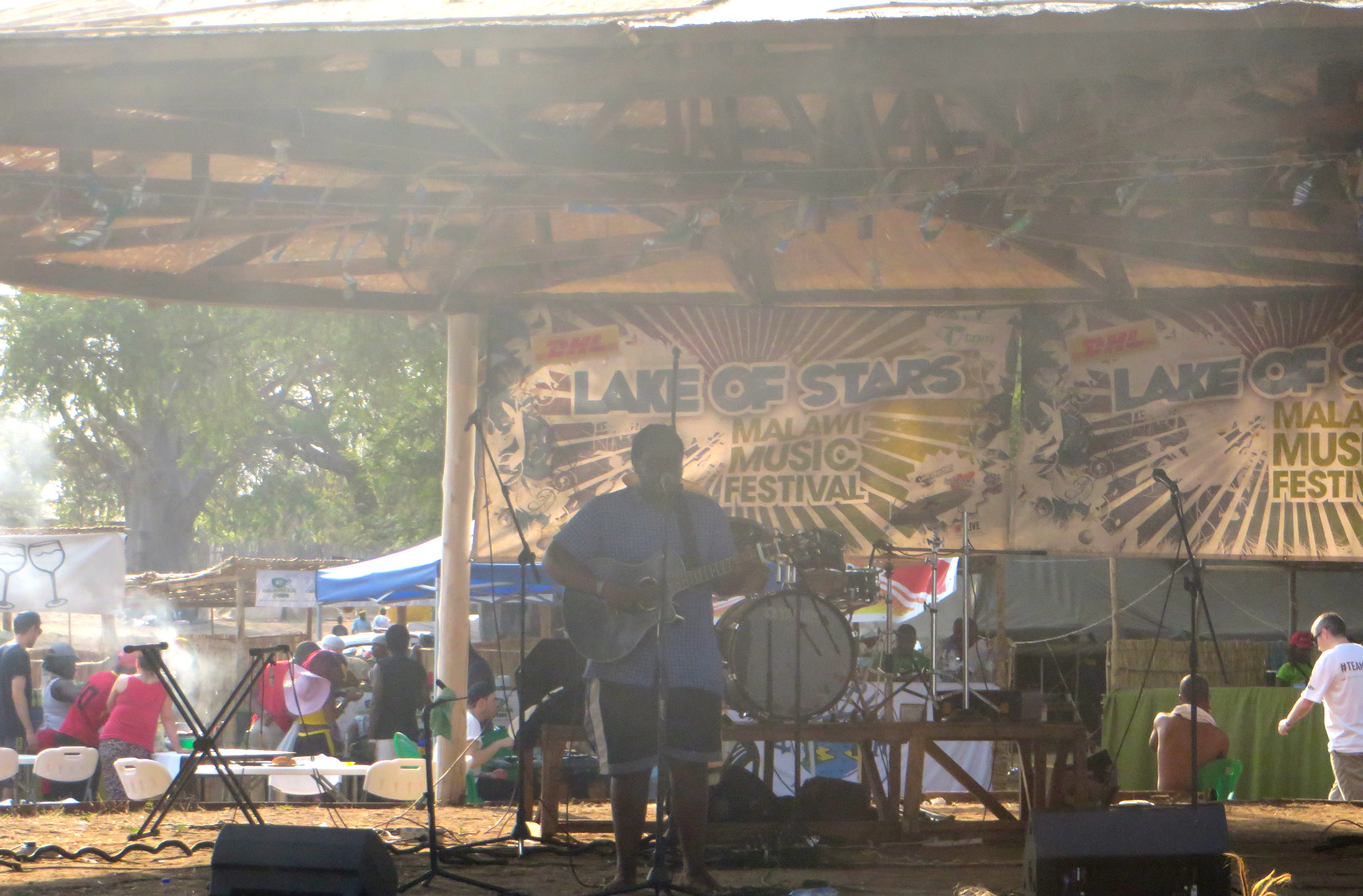 #LakeofStars George Kalukusha singing on the Village Stage on Day 2 of Lake of Stars Festival 2014.